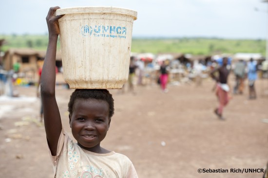 Amelia (12 years) is on her way to collect water in UNHCR Mole Refugee camp. Like the other refugees in the camp she is from Central African Republic.